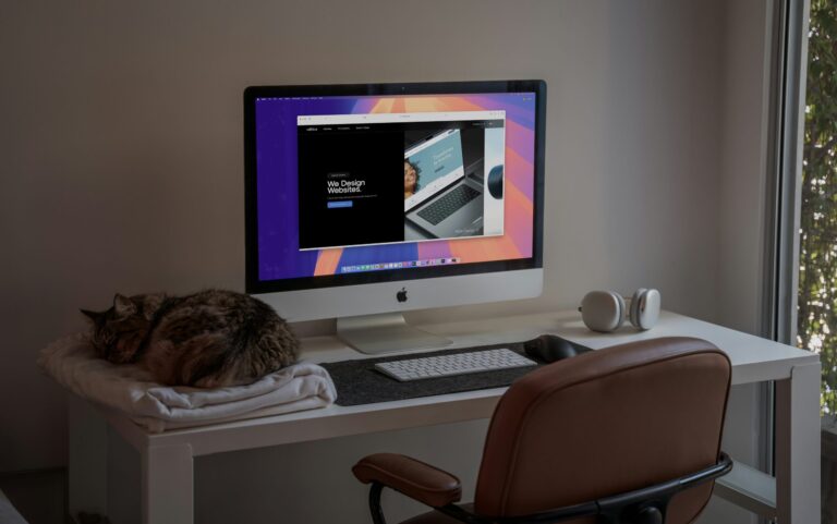 An iMac dektop computer with a webpage displayed on the screen.